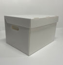 A white polypropylene file box with a hinged lid and cut out handles, flat packed and ready for assembly.