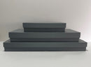 Stack of three gray fluted costume storage boxes made from Archival board